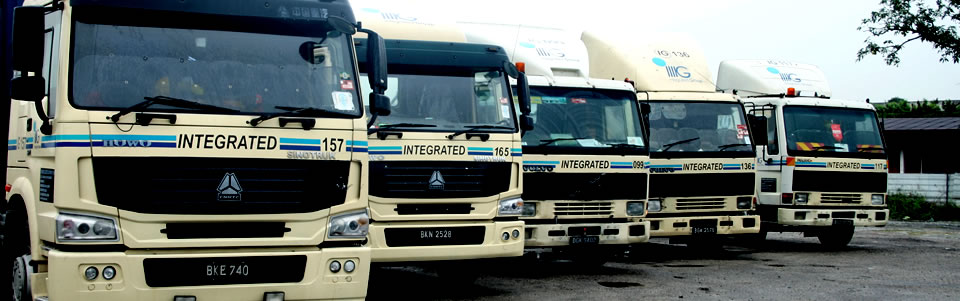 A row of Integrated Logistics Solutions prime movers lined up at the depot