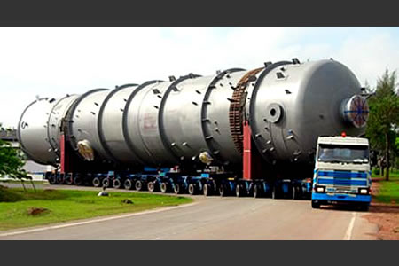 A long cylindrical pressure vessel carried on a hydraulic modular trailer behind an ILS prime mover